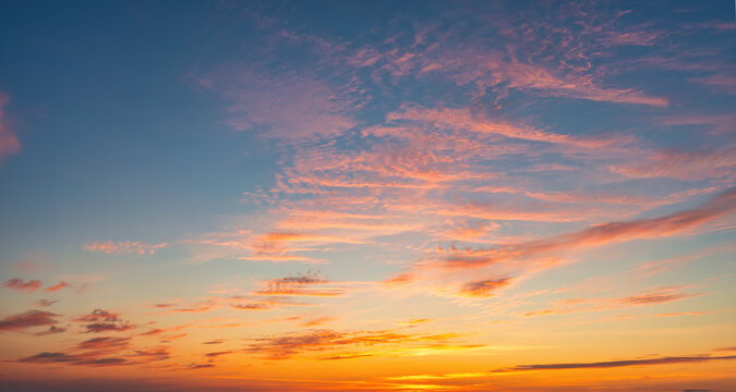 The sky before dawn, orange clouds on the background of the blue sky.