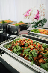 Thai food fried chicken with spicy herbs served on buffet