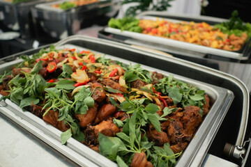 Fried spicy chicken kemangi herbs served on the event buffet