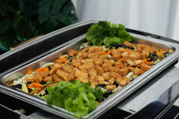 Fried tofu with vegetables serves on a big plate