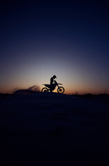 Night, sky and silhouette, person and motorcycle riding in nature, extreme sports on mockup background. Biking, motorbike and person driving on dirt road, dark and shadow, stunt or adventure, freedom