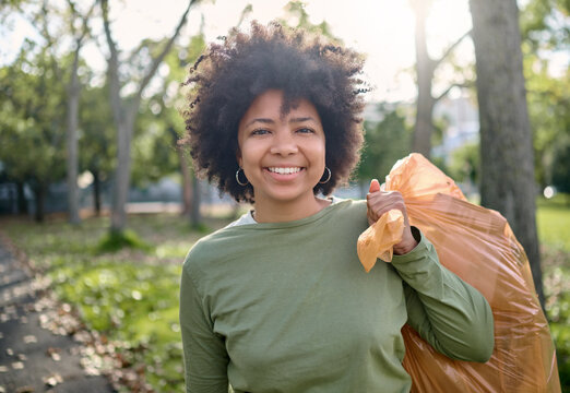 Trash, volunteer portrait and black woman cleaning garbage pollution, waste product or environment support. Plastic bag container, NGO charity and eco friendly person help with nature park clean up