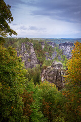 Obraz premium Panoramic birdview over monumental Bastei sandstone pillars near Kurort Rathen village in the national park Saxon Switzerland by Dresden and Elbe river, Saxony, Germany
