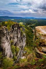 Panoramic birdview over monumental Bastei sandstone pillars near Kurort Rathen village in the national park Saxon Switzerland by Dresden and Elbe river, Saxony, Germany