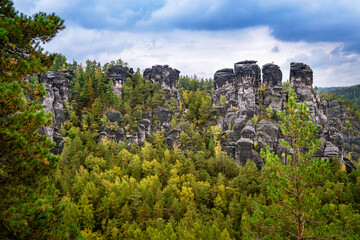 Panoramic birdview over monumental Bastei sandstone pillars near Kurort Rathen village in the national park Saxon Switzerland by Dresden and Elbe river, Saxony, Germany