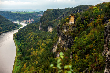 Panoramic birdview over monumental Bastei sandstone pillars near Kurort Rathen village in the national park Saxon Switzerland by Dresden and Elbe river, Saxony, Germany