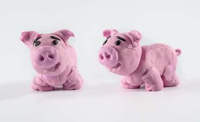farm animal s craft models of a cute pigs with soft clay play dough non toxic  isolated on  white background