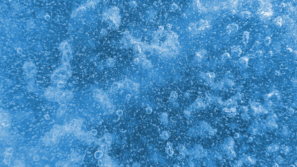 Fototapeta na wymiar Air bubbles on ice, close-up natural texture