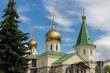 Fototapeta na wymiar Small Orthodox church with golden domes