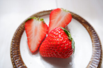 Fresh ripe red strawberries on a dish. Fresh strawberry fruits. 