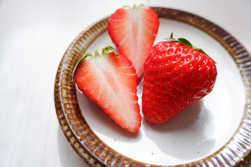 Fresh ripe red strawberries on a dish. Fresh strawberry fruits. 