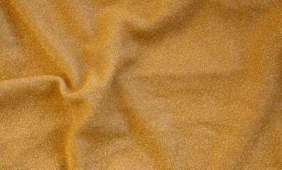 golden cloth golden background. golden artistic texture. Fabric with gold glitter