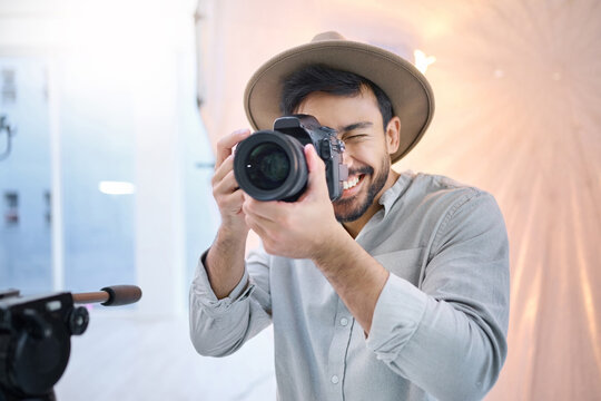 Photographer, camera and man in studio for photoshoot, creative and happy on space, mockup and background. Magazine, photography and backstage shooting professional male having fun session in Japan