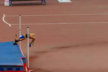 Foto op Plexiglas high jump female athlete in athletics event © sports photos
