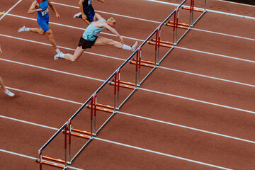 110 meter hurdles race men athletes athletics competition - obrazy, fototapety, plakaty