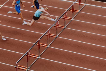 Zelfklevend Fotobehang 110 meter hurdles race men athletes athletics competition © sports photos