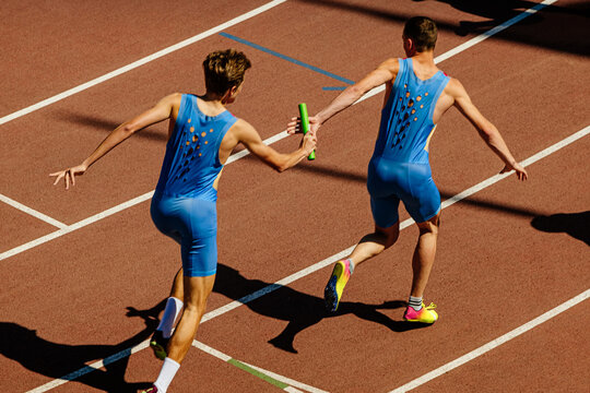 male relay race running for track and field competition