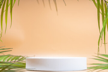 Summer stands mockup photo.  Background with white stone pedestal stands, on beige sunny background with palm leaves, free space for product