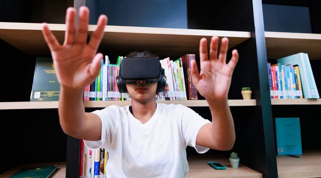 VR headset library. Young teen girl student training and learning with VR virtual teality headset in school library.