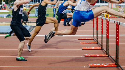 Naklejka premium group athletes runners run 110 meters hurdles