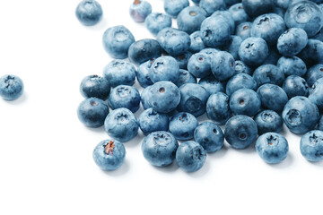 Fresh blueberries scattered on a white background.