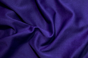 Fototapeta premium Blue fabric background. Blue cloth waves background texture. Blue fabric cloth textile material.