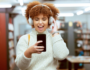 Headphones, phone and woman in the library with music, radio or podcast for study motivation....
