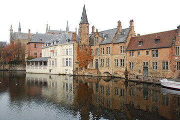 Naklejka na ściany i meble Bruges, Belgium buildings and water