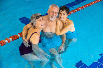 Group of seniors at the swimming pool looking happy and enjoyed