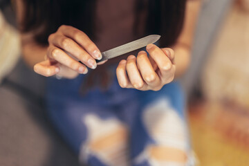  Women's nails and nail file. Self-manicure at home for yourself.