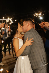 Fototapeta na wymiar newlyweds at a wedding of sparklers