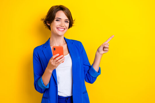 Photo of positive agent lady web promoter use gadget demonstrate eshop ads isolated on bright color background