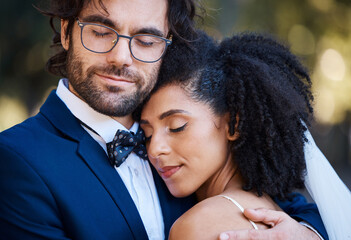 Interracial couple, wedding and hug for love at marriage celebration event with commitment. Happy...