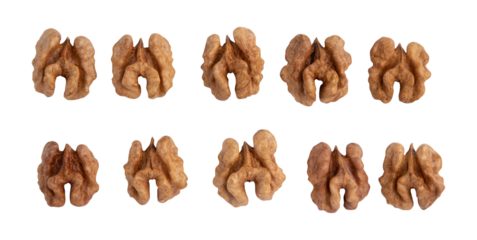 halves of walnuts isolated on white background, pattern top view, snack food concept, vegan meal