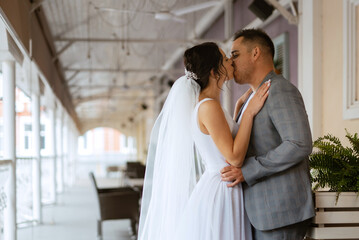Naklejka premium young couple the groom in and the bride on a walk