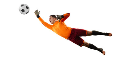 Young man, soccer football goalkeeper catches ball in jump isolated over white background. Concept...
