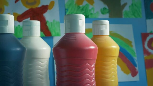 Paint Bottles In Junior School Classroom Moving Shot
