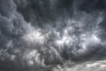 Dramatic dark storm rain clouds black sky background. Dark thunderstorm clouds rainny atmosphere....