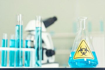 Biohazard disease alert corona outbreak sign on glass wall laboratory science center. Medical care clinic with hazard alert sign. Medical Healthcare concept.