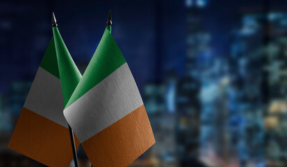 Small flags of the Ireland on an abstract blurry background