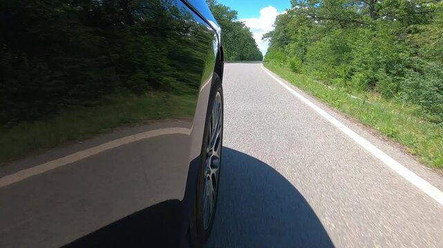 Porsche Macan Turbo exterior side shot of the wheel spinning