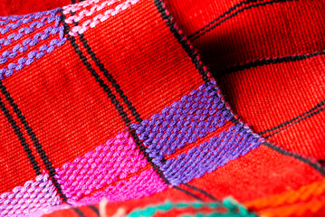 Handmade textile detail made by Guatemalan artisan in Central America, colorful detail full of tradition and culture, colonial history, Mayan cosmovision. 