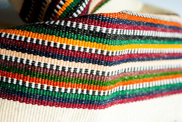 Handmade textile detail made by Guatemalan artisan in Central America, colorful detail full of...