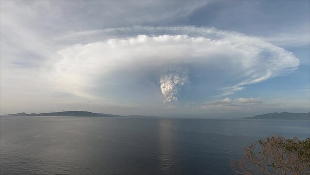 View of the volcanic eruption across the strait. Taal volcano eruption. Luzon Island, Philippines.