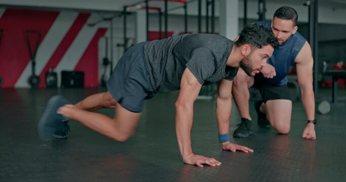 Personal trainer, fitness and coaching with people in gym for sports, workout and cardio performance. Learning, help and motivation with men training on ground for health, exercise and wellness