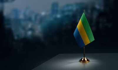 Small flags of the Gabon on an abstract blurry background