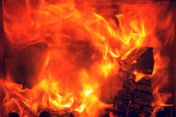 Fototapeta premium Flames of fire in a fireplace.Abstract background.