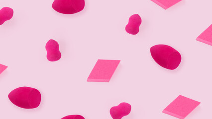 Magenta make-up sponges PATTERN on pink background Beauty concept Cosmetics