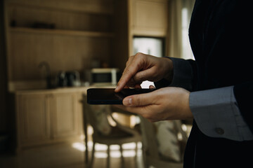 Mature businessman using a digital tablet to discuss information with a younger colleague in a modern business lounge