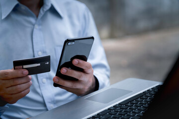 Man paying and shopping with smartphone application. Digital money transfer, banking and e commerce concept.Mobile payment with wallet app technology.